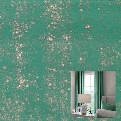 Green velvet curtain fabric with soft texture, shown in a modern living room setting